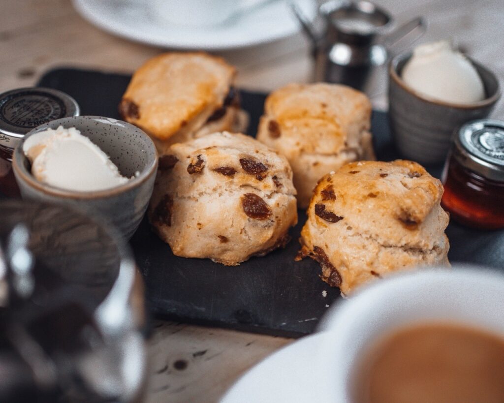 selection of fruit scones served with tea, cream and jam during an autumn stay at the snooty fox tetbury