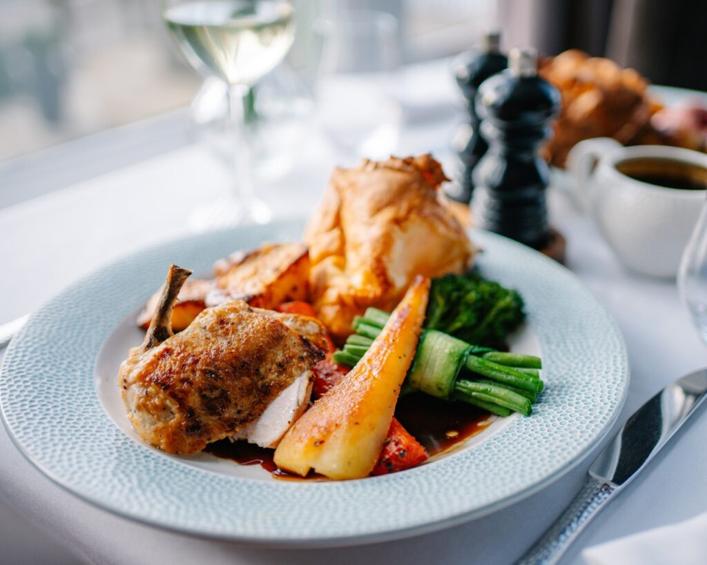 Roast chicken on a dining table in the snooty fox restaurant from the sunday sorted menu.